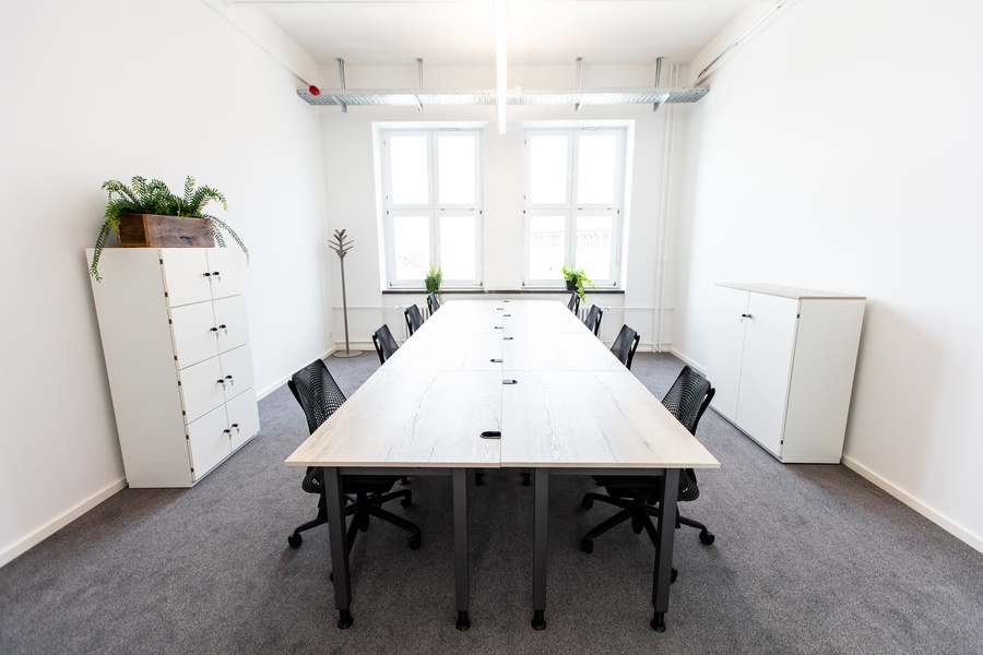 Furnished office spaces including meeting rooms and community areas